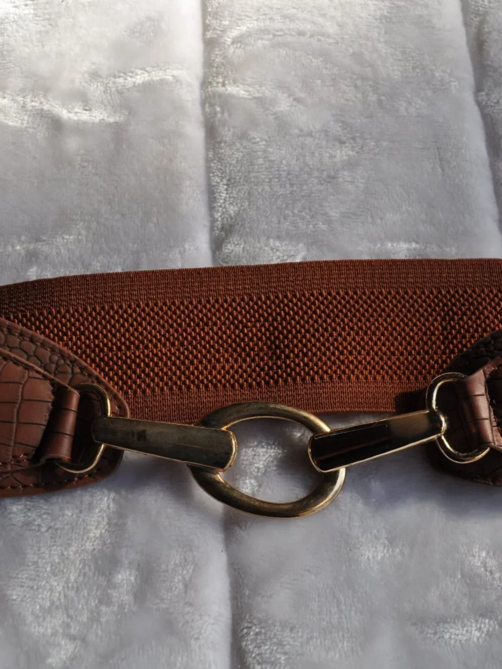Women's brown Vince Camuto faux leather elastic wide belt features a gold circle